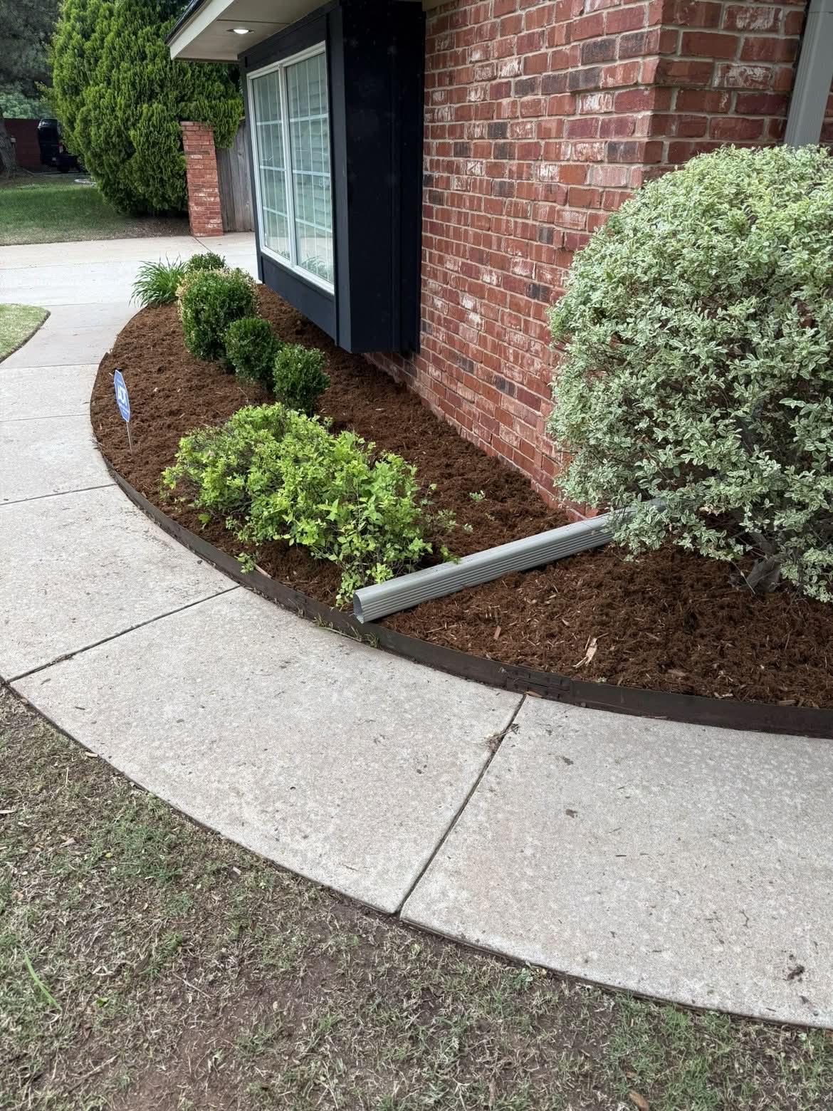 Flower bed after mulch install Edmond OK